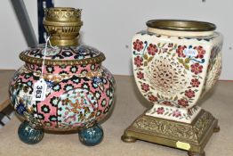 A FISCHER BUDAPEST OIL LAMP BASE AND URN, comprising a floral design lamp base on a pink ground,