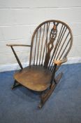 AN ERCOL PRINCE OF WALES BACK ROCKING CHAIR with open armrests, width 73cm x depth 83cm x height