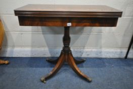 A BEVAN FUNNELL REPRODUX MAHOGANY FOLD OVER GAMES TABLE, the top enclosing a green playing baize and