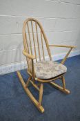 AN ERCOL BLONDE ELM AND BEECH QUAKER ROCKING CHAIR (condition report: general signs of usage, some