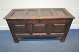 A GEORGIAN OAK AND PARQUETRY INLAID COFFER, the hinged lid enclosing a fitted candle box (