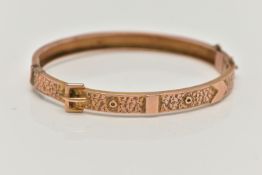 A LATE VICTORIAN 9CT ROSE GOLD HINGED BANGLE, belt and buckle design with ivy leaf detail, fitted