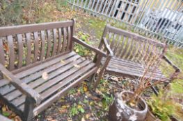 A PAIR OF STAINED TEAK SLATTED GARDEN BENCHES, length 122cm (condition report: paint peeling, frames