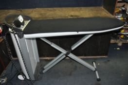 A MIELE FASHION MASTER IRONING STATION, model B3826, with built in folding ironing board and iron,