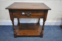 A REPRODUCTION OAK LAMP TABLE, with a single frieze drawer, on turned legs, united by an undershelf,
