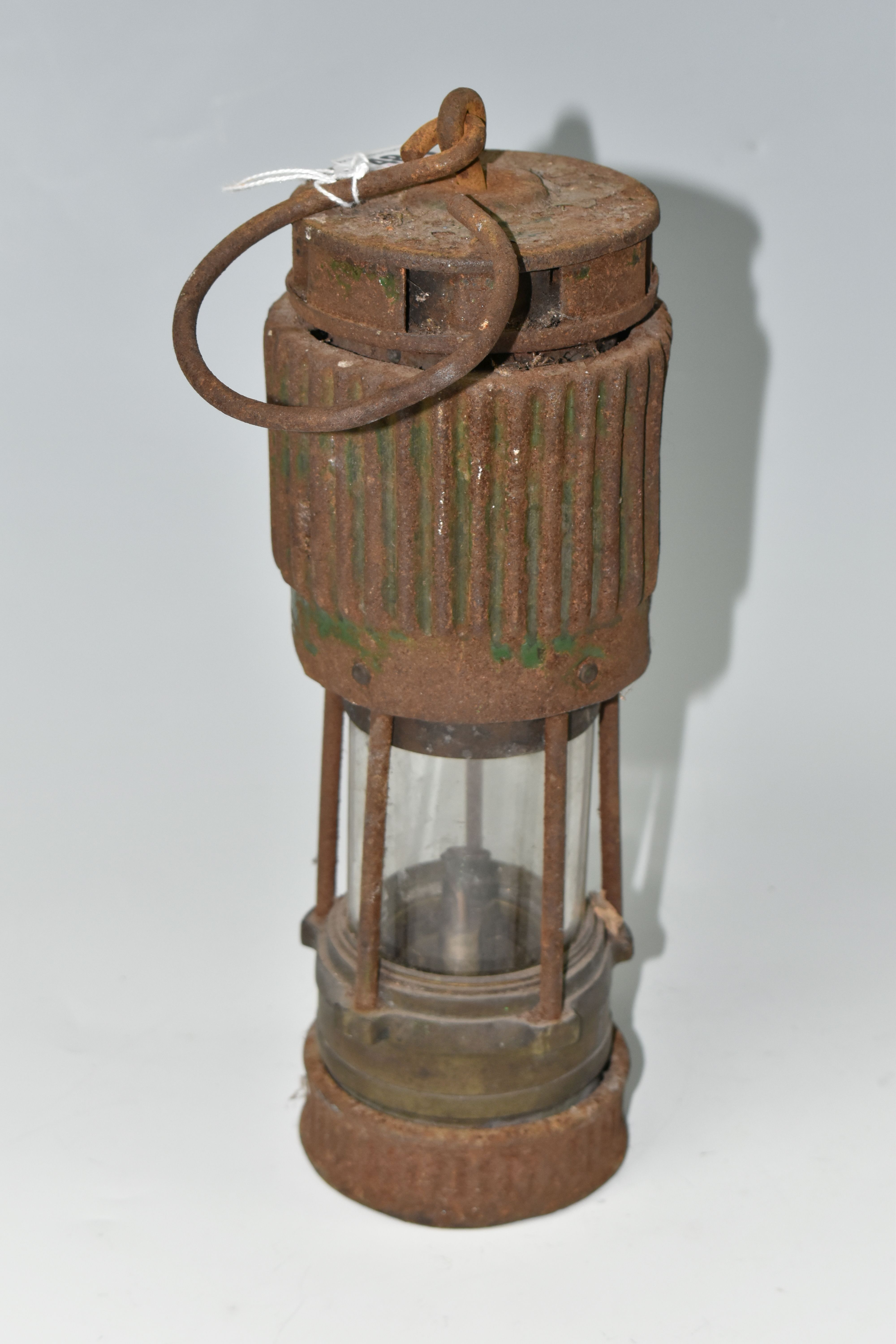 A VINTAGE PATTERSON TYPE MINER'S LAMP, in rusted condition, lettering to top indistinct, bears - Image 3 of 4