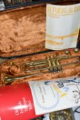 A CASED BRASS LAFLEUR TRUMPET IMPORTED BY BOOSEY & HAWKES OF LONDON, serial no. 043698, the fitted