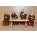 A BRETBY POTTERY TABLEAU OF FOUR MONKS SITTING AROUND A TABLE DRINKING AND PLAYING CARDS (5) (