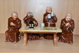 A BRETBY POTTERY TABLEAU OF FOUR MONKS SITTING AROUND A TABLE DRINKING AND PLAYING CARDS (5) (