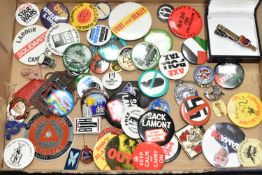 ONE BOX containing over sixty enamel and metal pin badges, keyrings, etc, mainly of a left-wing
