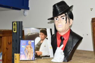 A MICHAEL JACKSON BUST, THRILLER LP AND DVD, the hollow resin bust of the singer wearing his