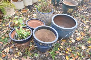 SIX VARIOUS BLUE GLAZED PLANT POTS, of various sizes, largest diameter 47cm x height 35cm, along