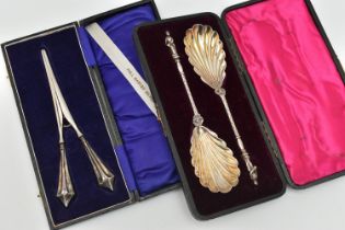 CASED SILVER SPOONS AND GLOVE STRETCHERS, the pair of cased late Victorian silver spoons have