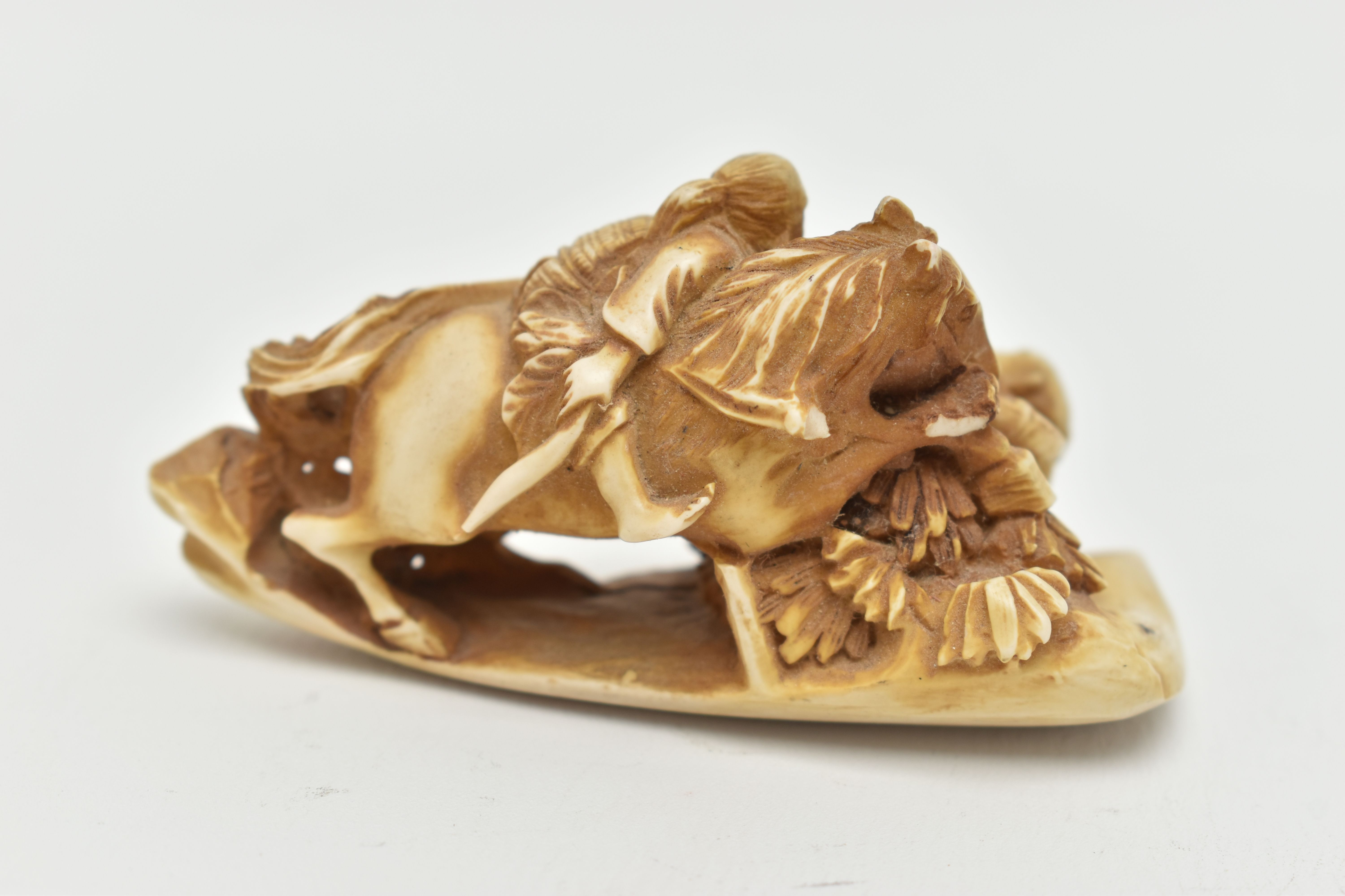 A BONE OKIMONO, a carved ornament depicting a man on a horse over a fallen down man, approximate - Image 3 of 7