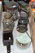 A GROUP OF LAMPS AND LANTERNS, to include a carriage lamp, a nautical lantern, a railway lantern