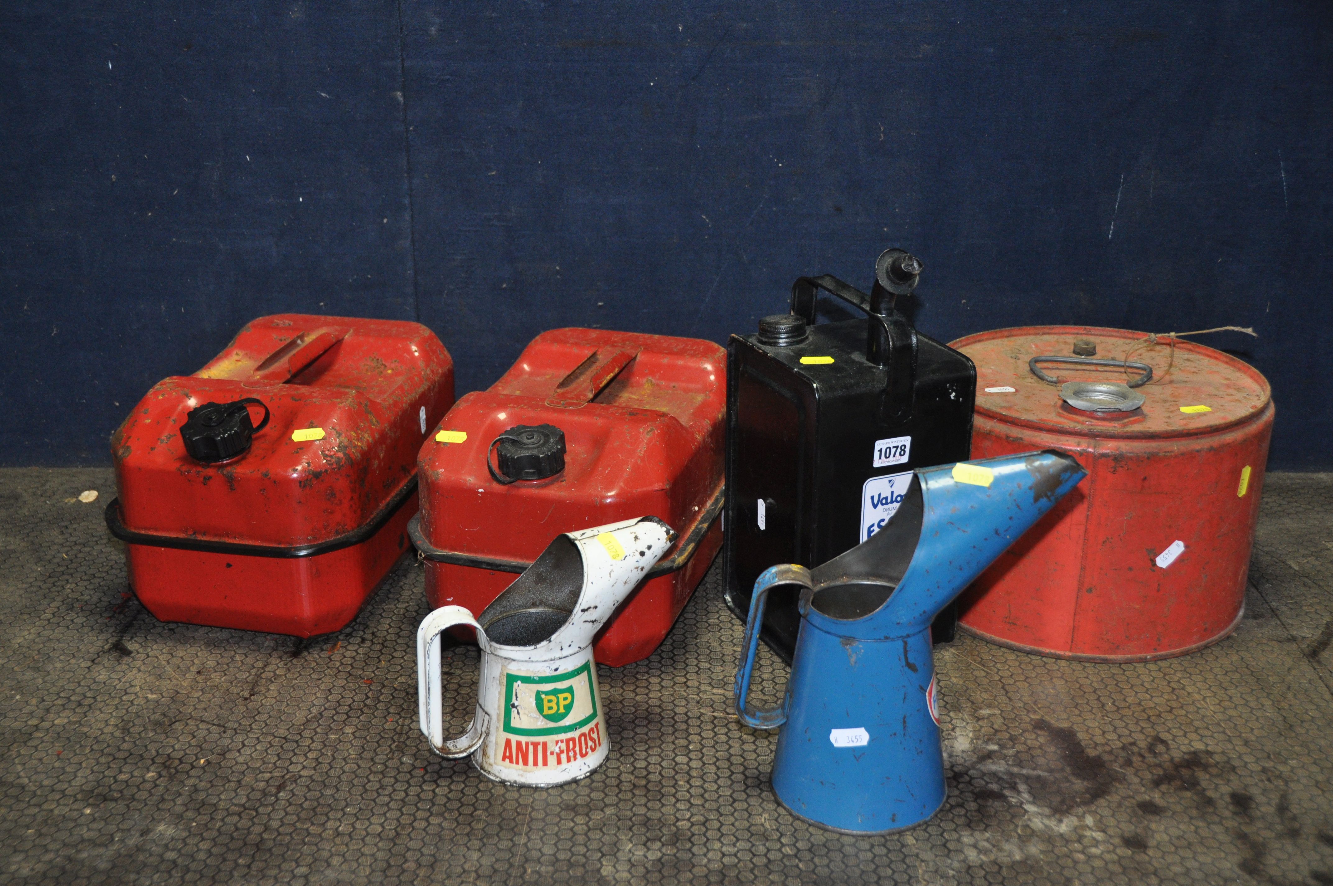 TEN VINTAGE FUEL AND OIL CANS including a Fina and a BP oil cans, two petrol cans, a Valor