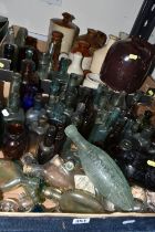 TWO BOXES OF EARLY 20TH CENTURY COLOURED GLASS BOTTLES AND STONEWARE JARS, to include a brown salt