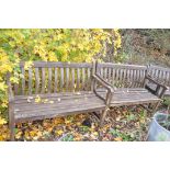 A PAIR OF STAINED TEAK SLATTED GARDEN BENCHES, length 122cm (condition report: paint peeling, frames