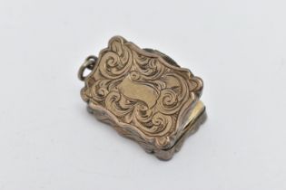 A VICTORIAN SILVER VINAIGRETTE OF WAVY RECTANGULAR OUTLINE, foliate engraved decoration, vacant