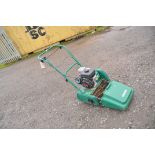 A QUALCAST CLASSIC PETROL 35s cylinder mower with grass box and a Kawasaki FJ100D engine. (Engine