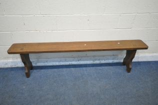 A 20TH CENTURY OAK BENCH, with trestle legs, length 192cm x depth 25cm x height 46cm (condition