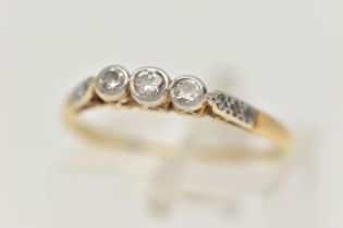 AN 18CT GOLD THREE STONE DIAMOND RING, designed as three graduated round brilliant cut diamonds in