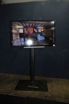 A TOSHIBA 32LL3C63DB 32in TV with tall stand and remote (no back to remote )(PAT pass and working)