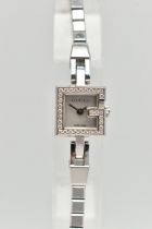 A GUCCI DIAMOND SET WRISTWATCH, the mother of pearl square dial, signed 'Gucci Swiss Made', square