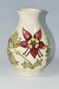 A MOORCROFT POTTERY 'COLUMBINE' VASE, the baluster vase decorated with red and yellow columbine