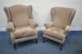 A BEIGE AND STRIPPED UPHOLSTERED WING BACK ARMCHAIR, on cabriole front legs, width 87cm x depth 90cm