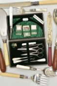 A CASED SEWING KIT AND CUTLERY, the black case with green suede interior, together with button hook,