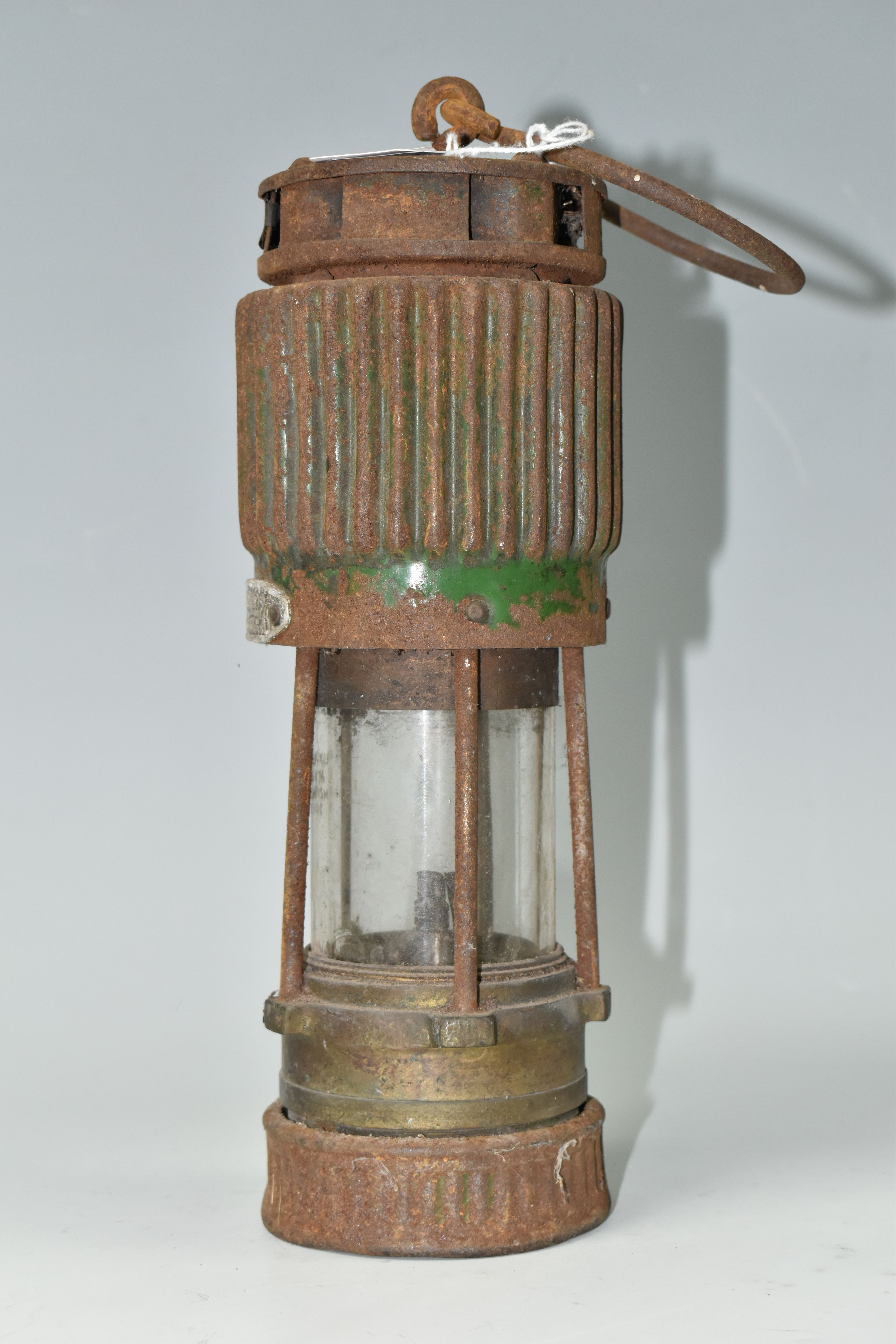 A VINTAGE PATTERSON TYPE MINER'S LAMP, in rusted condition, lettering to top indistinct, bears - Image 4 of 4