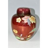 A CARLTON WARE GINGER JAR AND COVER WITH THE KINGFISHER PATTERN ON A ROUGE GROUND, the base