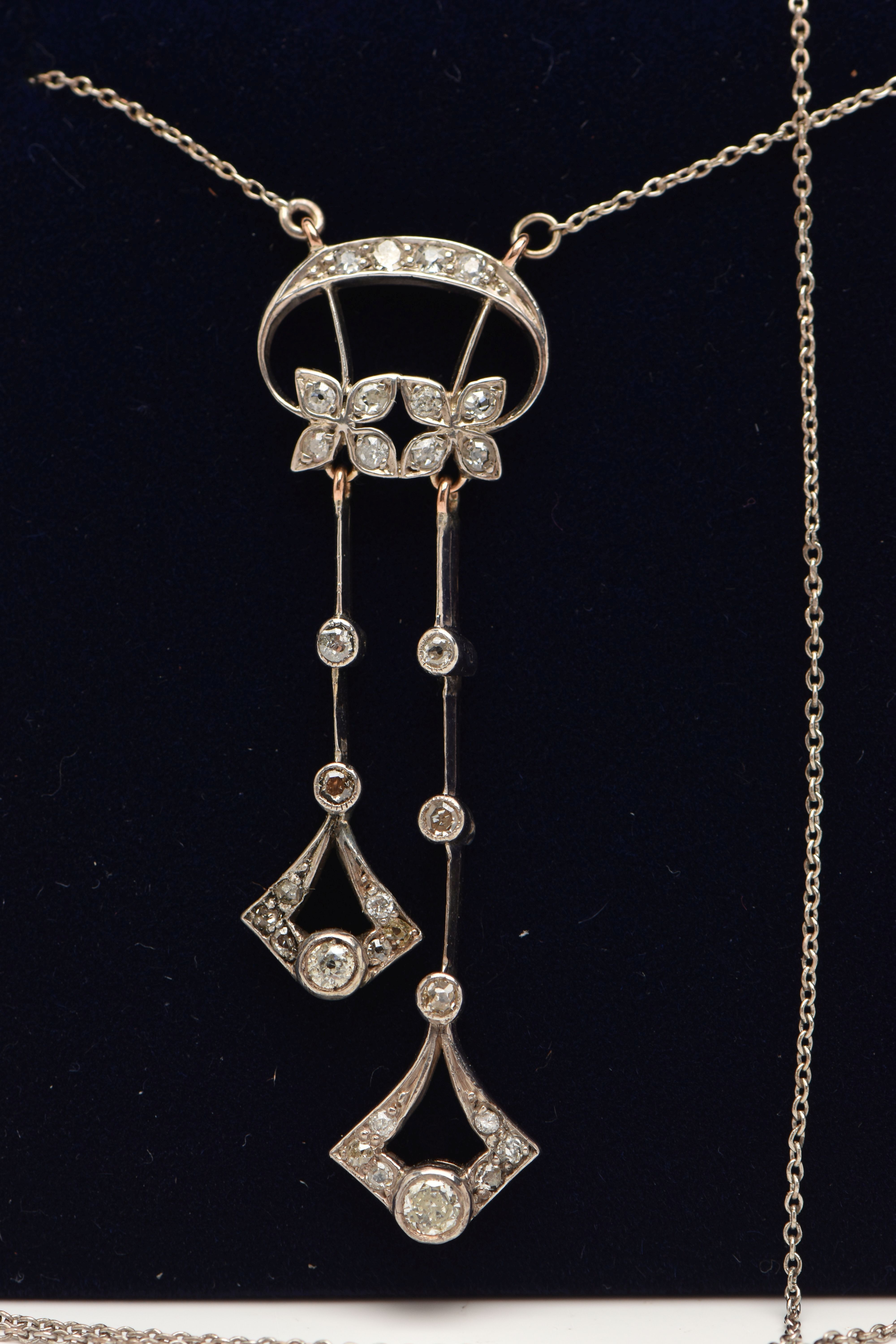AN EARLY 20TH CENTURY DIAMOND NECKLACE, designed as two flower heads beneath a crescent line, - Image 2 of 4