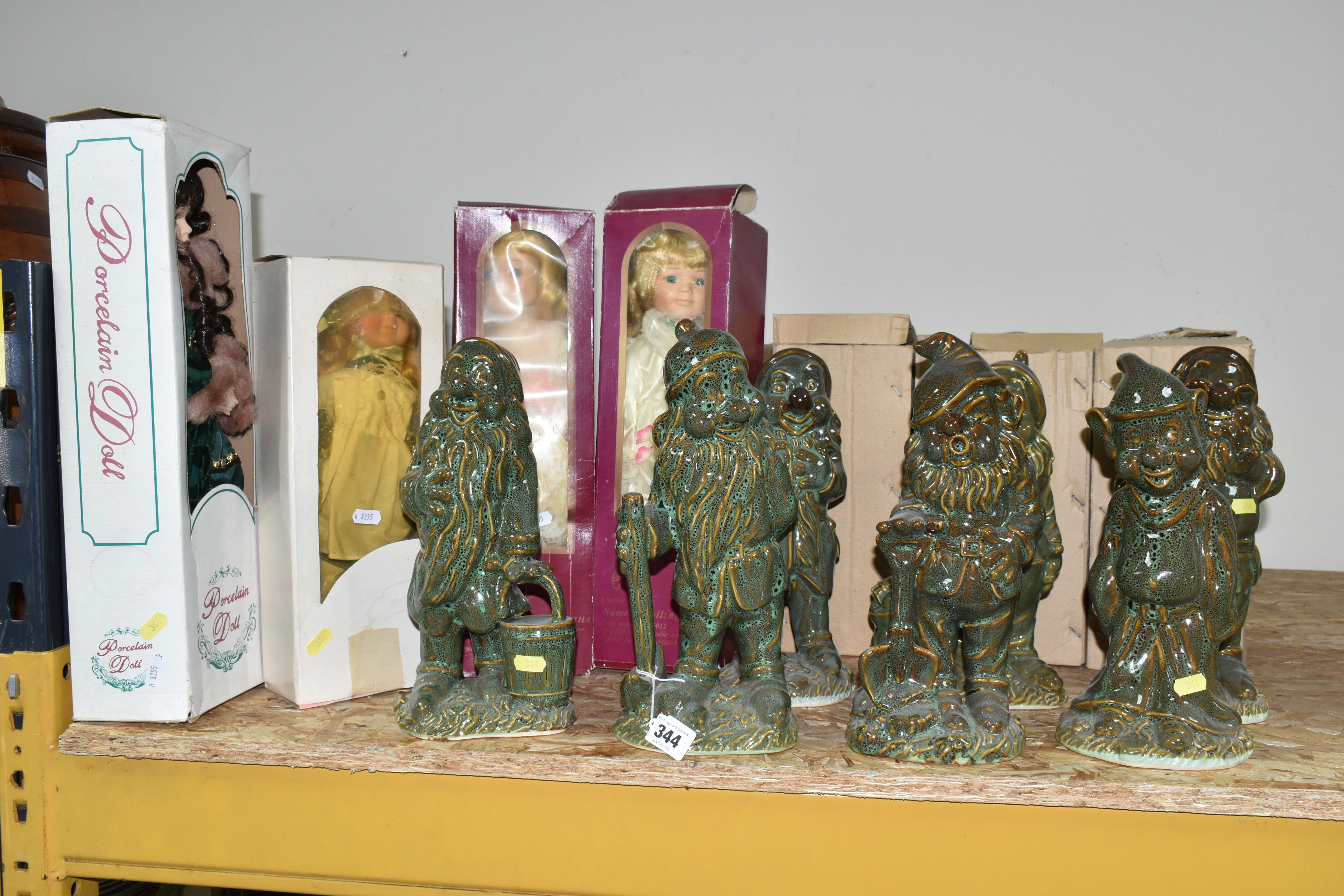 A GROUP OF BOXED CERAMIC SNOW WHITES' SEVEN DWARFS FIGURES, mottled green glaze, comprising Doc,