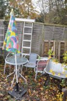 A CIRCULAR METAL AND GLASS GARDEN TABLE, diameter 60cn x height 70cm, a pair of rattan armchairs,