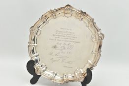 AN ELIZABETH II SILVER SALVER WITH PRESENTATION INSCRIPTION, shell and scroll border, the centre