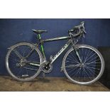 A CARRERA CRIXUS CX GENTS ROAD BIKE with 16 speed Shimano Claris gears with brake lever shift,