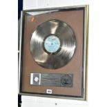 A FRAMED PLATINUM DISC AWARDED TO ROBERT PLANT FOR THE 'PRINCIPLE OF MOMENTS' LONG PLAYING ALBUM,