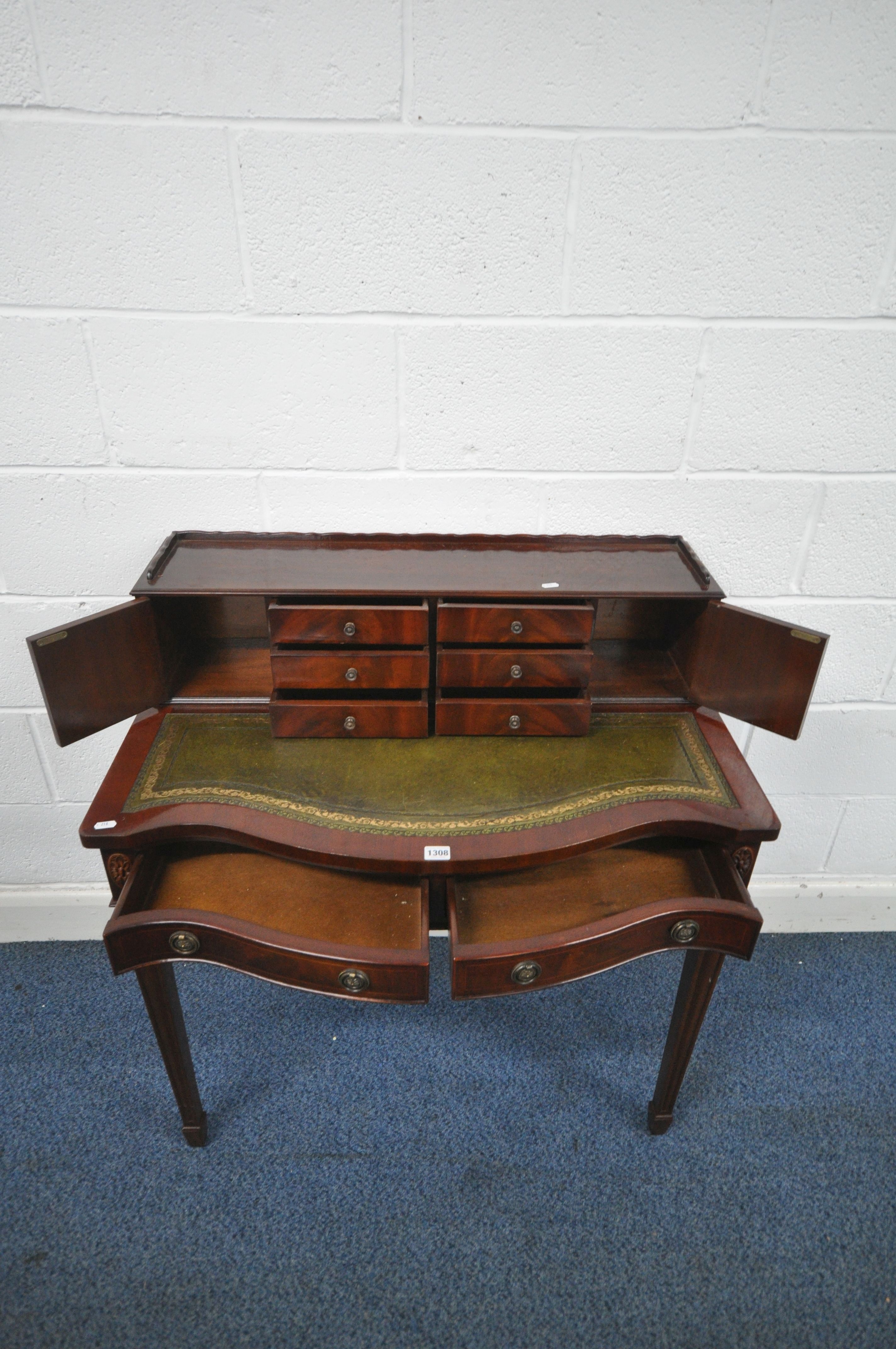 A 20TH CENTURY MAHOGANY BOW FRONT LADIES DESK, with a raised back, fitted with an arrangement of - Image 2 of 4