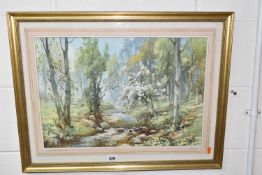 HAROLD GRESLEY (BRITISH 1892-1967) 'DOVEDALE, DERBYSHIRE', a Springtime river landscape with two
