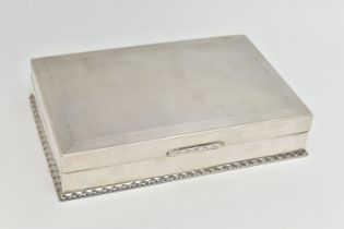 AN EARLY 20TH CENTURY SILVER CIGARETTE BOX, table top box, of a rectangular form, engine turned