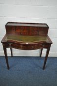 A 20TH CENTURY MAHOGANY BOW FRONT LADIES DESK, with a raised back, fitted with an arrangement of