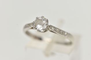 A PLATINUM SINGLE STONE DIAMOND RING, the old cut diamond in an eight claw setting, with three