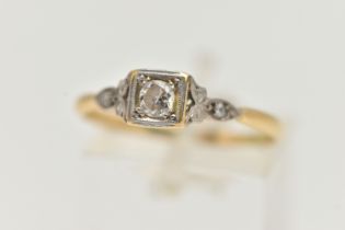 A DIAMOND RING, designed as a round brilliant cut diamond within a square setting with diamond