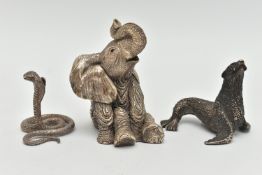 THREE ANIMAL ORNAMENTS, the first a filled silver seated elephant, with silver hallmark, the
