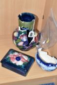 TWO PIECES OF MOORCROFT POTTERY AND A MACINTYRE SUGAR BOWL, all in very poor condition, the