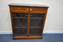 AN EDWARDIAN MAHOGANY BOOKCASE, with two drawers above double astragal glazed doors, enclosing two