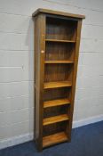 A MODERN SOLID OAK OPEN BOOKCASE, with four adjustable shelves and a single fixed shelf, width