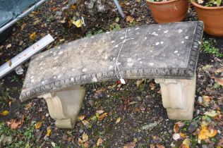 A MODERN COMPOSITE CURVED GARDEN BENCH with scrolled and scallop detail to outside edges of bases,